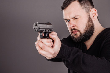 man with pistol. dangerous and criminal concept