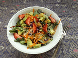 Mixed couscous salad with vegetables and strawberries