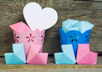 Paper hearts pink and blue color In decorative buckets Abstract symbol of man (boy) or woman (girl) 