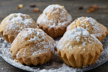 Muffins with sugar icing and raisins
