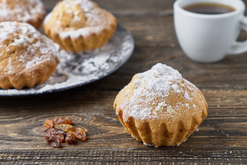 Muffins with sugar icing and raisins