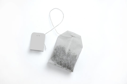 Teabag with grey label. Top view. Isolated on a white. mockup