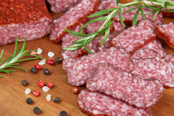 Sliced salami on a wooden board