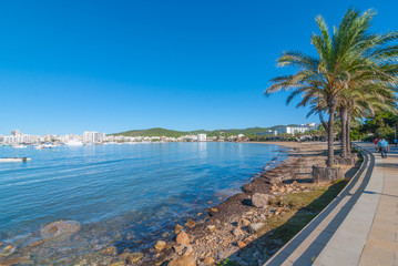 Ibiza sunshine on the waterfront in Sant Antoni de Portmany,  Take a walk along the main boardwalk, now a stone concourse beside the beach. 