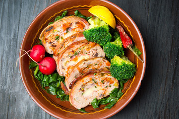 Baked rolled meat with vegetables