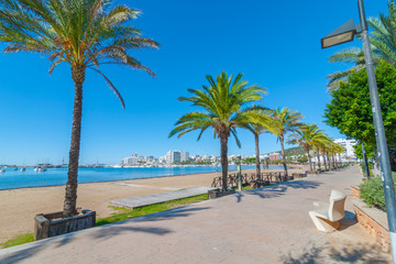 Ibiza sunshine on the waterfront in Sant Antoni de Portmany,  Take a walk along the main boardwalk, now a stone concourse beside the beach. 