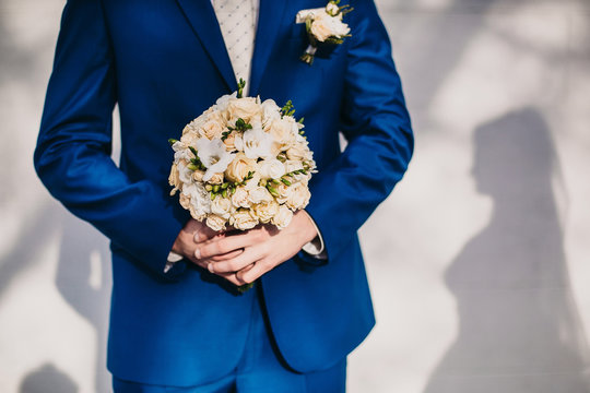 Bridegroom Holding A Bouquet