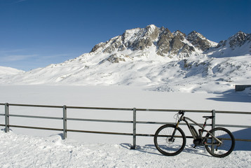 landscape: electric bicycle, e-bike, mountain bike on the snow of the mountains of formazza val,...