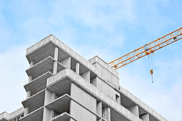 Crane and highrise construction site