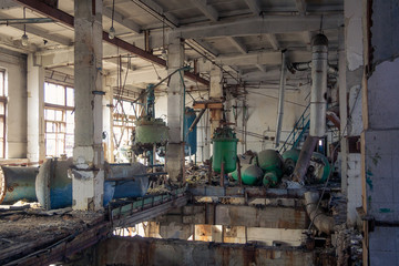 Fototapeta na wymiar The abandoned chemical pharmacy vitamin plant with the remains of equipment