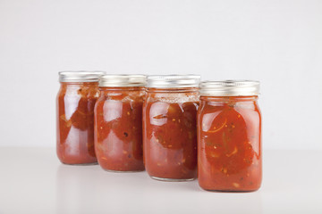 Fototapeta na wymiar Jars of homemade canned spaghetti sauce