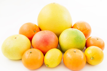 Fruit's background. Citrus fruits - lemon, orange, grapefruit, sweetie and pomelo isolated on white background.