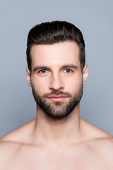 Obraz premium A portrait of young handsome shirtless man looking at camera