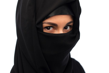 Naklejka premium muslim woman in hijab over white background