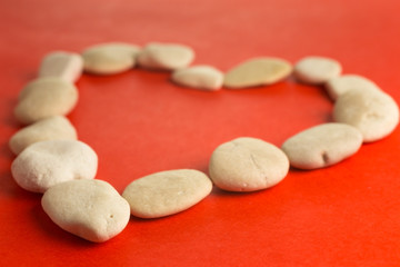 red heart with white stones
