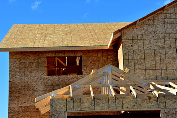 wood frame residential building under construction.