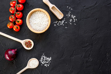 ingredients for paella on dark background top view