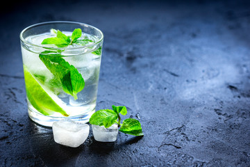 mojito in glass on dark background close up