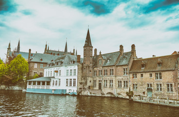 Fototapeta premium Colourful architecture of Bruges buildings along canal