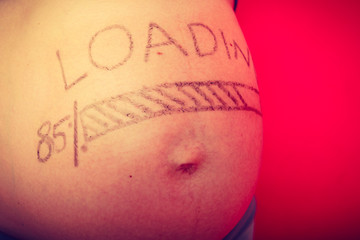 Pregnant woman belly with drawings