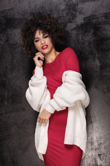 Obraz premium Fashionable girl with afro hairstyle posing.