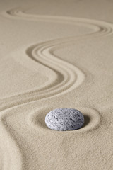 Fototapeta na wymiar zen budhism meditation stone and sand. Paterns for relaxation and concentration...