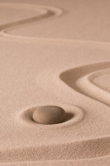 Fototapeta na wymiar Zen meditation stone and sand garden. Symbol for spirituality harmony and purity...