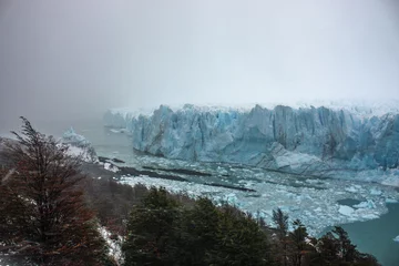 Fotobehang Waterfront on a stormy day at the Perito Moreno Glacier in Patagonia, Argentina. © Natalia