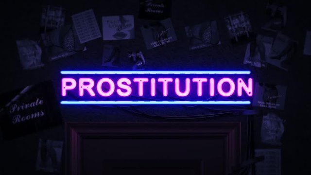 Prostitution Neon Sign Turning On And Off Above A Door