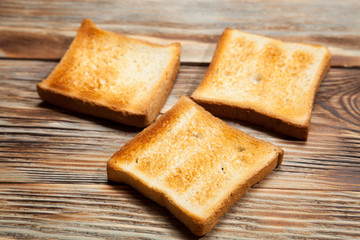 Toast on a rustic wooden background