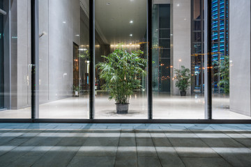 square front of modern office buildings in Shanghai financial district.