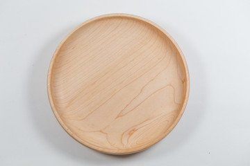 Empty wooden plate in white background.