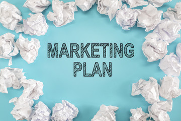 Marketing Plan text with crumpled paper balls