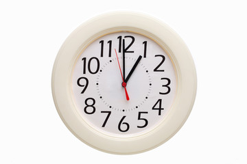 Analog wall clock showing one o'clock