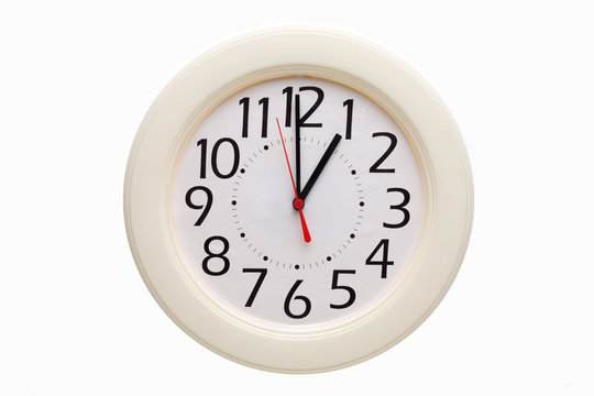 Analog wall clock showing one o'clock