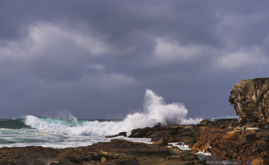 Winter Storm Waves breaking shoreline. Copyspace.