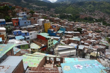The beautiful brightly colored, closely built buildings of San Javier in Medellin, Colombia.