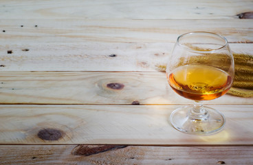 Brandy on wood background