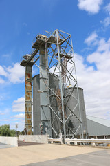 Fototapeta na wymiar weighbridge, hoppers and silos at a grain storage facility