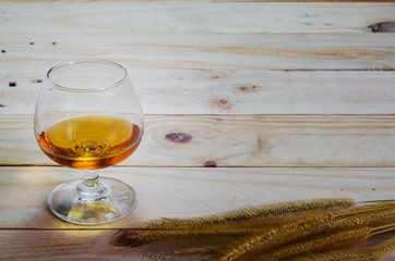 Brandy on wood background