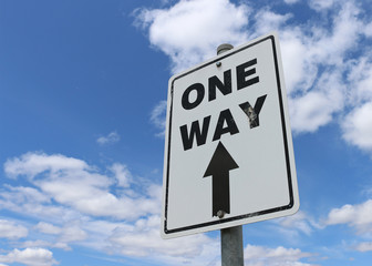 black and white One Way sign in a bright blue cloudy sky