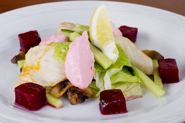 Lettuce salad, beetroot salmon fillet with tender cream sauce