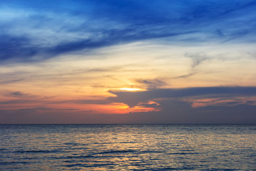 Naklejka na ściany i meble sunset over ocean on a clear evening