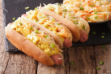 Tasty sandwich with sausage, sauerkraut and mustard close up. horizontal