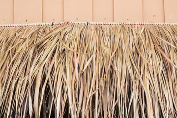 Abstract dry thatch roof of traditional Thai house
