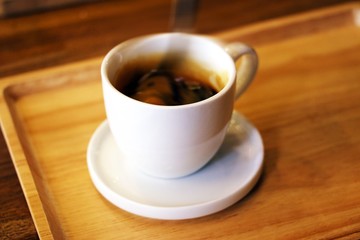 spoon is stirring motion in espresso cup