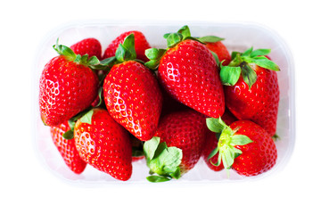 Fresh Strawberries in a box isolated on white  background close up.