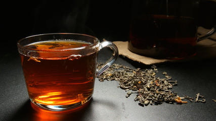 Hot black tea in a cup on a table