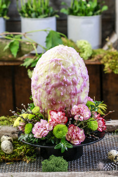 Wax egg with flowers. Traditional easter decoration.