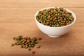 fresh green and orange peppercorns
